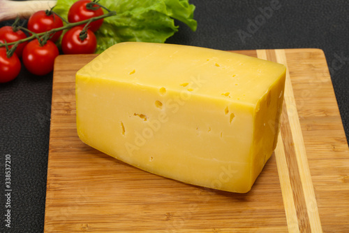 Hard yellow tasty cheese brick