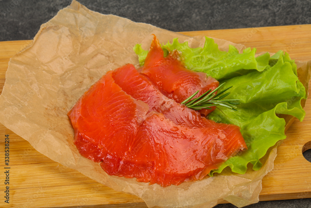 Sliced salmon fillet served rosemary Sliced salmon fillet served rosemary
