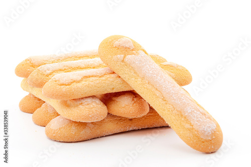 Italian desserts and sponge cookies concept with lady fingers or savoiardi biscuit isolated on white background