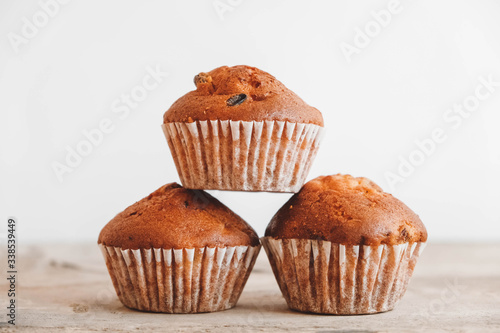 Chocolate cupcakes on wooden table background. Copy, empty space for text