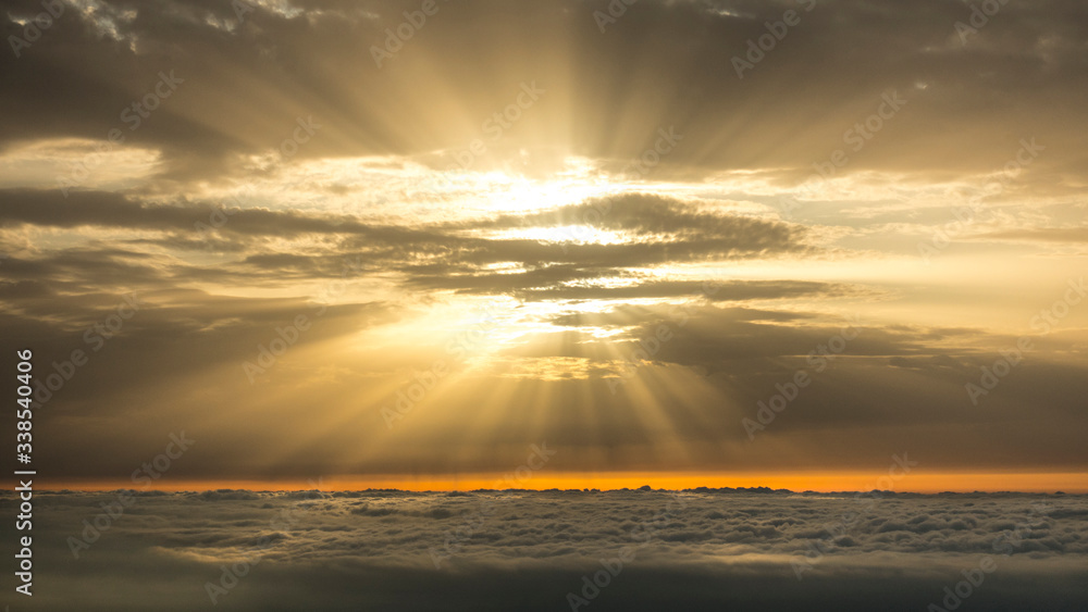 Sun rays between clouds