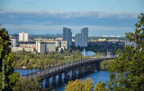 Aerial top view of Paton bridge, left bank of Dnipro river and new districts of the Kyiv city, Ukraine