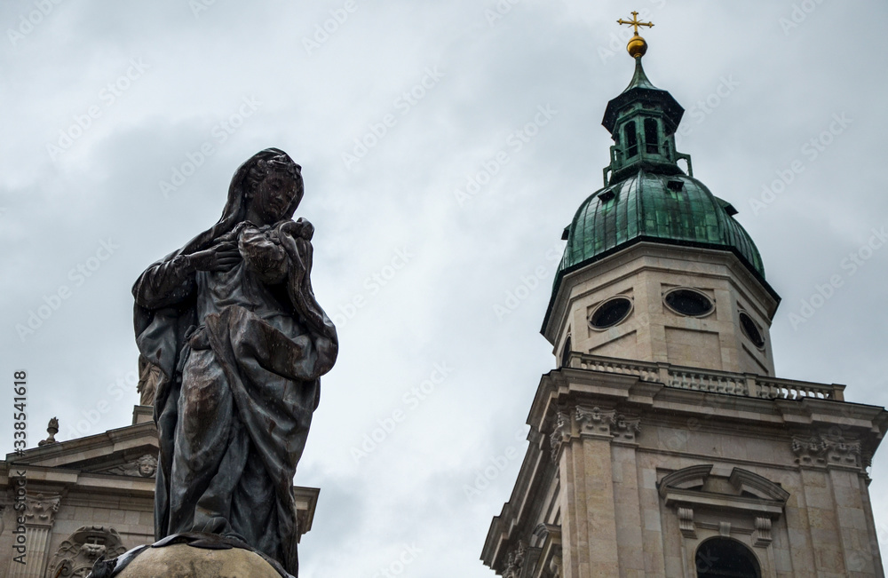 The Maria Immaculata (Immaculate Mary) column, with the catholic church salzburger Dom (Domplatz) in background, Austria The Maria Immaculata (Immaculate Mary) column, with the catholic church salzburger Dom (Domplatz) in background, Austria