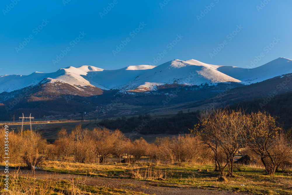 Spring landscape with snowy mountains and Tezh mount, Armenia