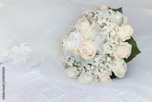 detail of pink fresh roses bouquet with Gypsophila paniculata. Wedding ceremony