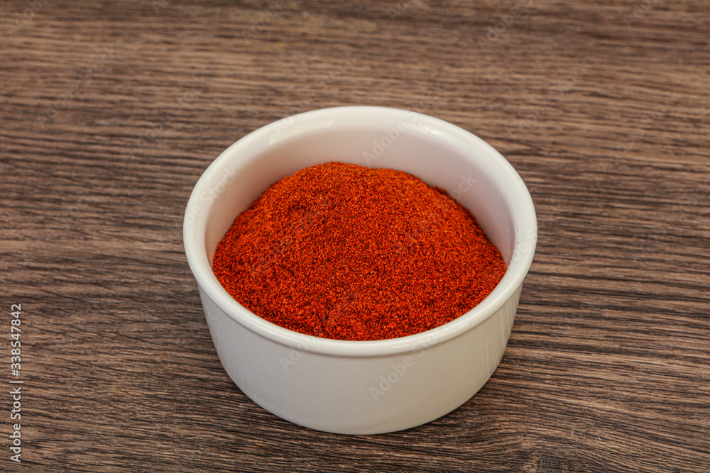 Dry paprika powder in the bowl Dry paprika powder in the bowl