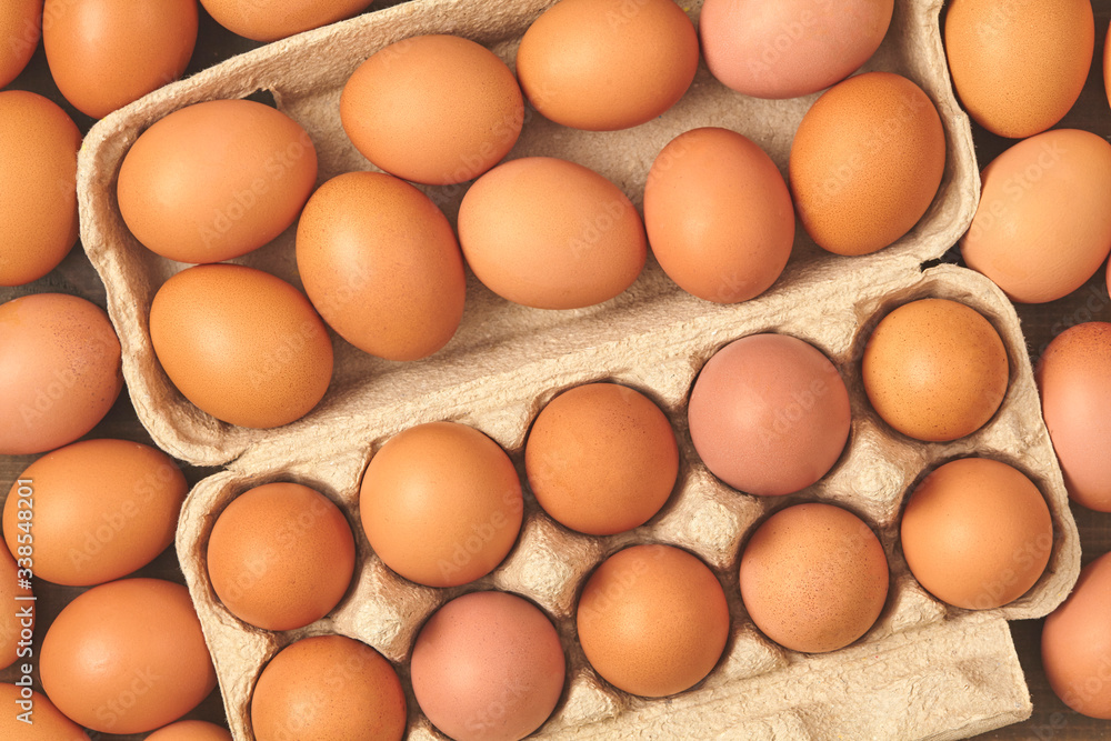 many fresh chicken brown eggs top view many fresh chicken brown eggs top view