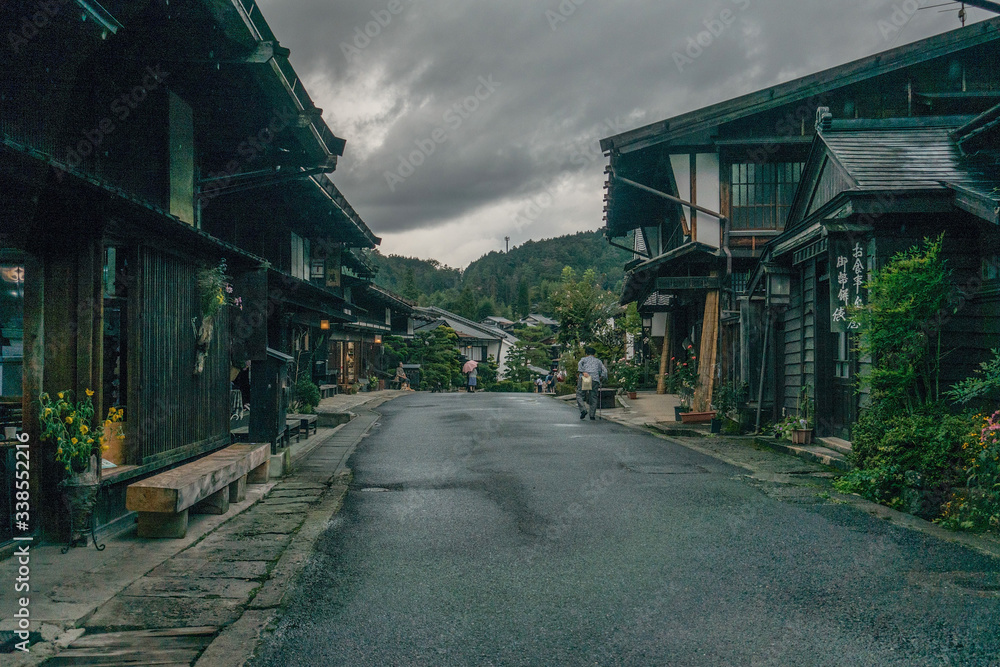Black houses in a cozy village in Japan on an overcast day