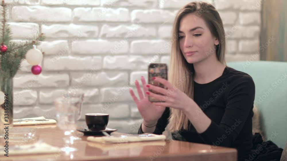 Lovely girl joy in coffee while taking selfie and networking in the restaurant. Covid-19
Lovely girl joy in coffee while taking selfie and networking in the restaurant. Covid-19