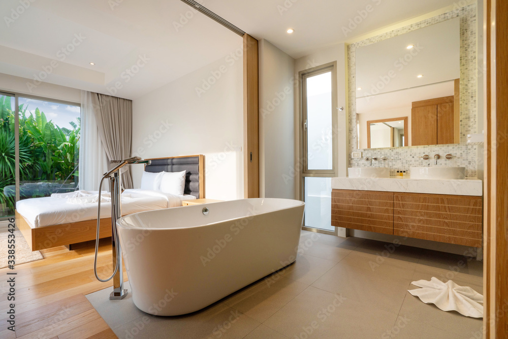 Interior design of bedroom with bathtub in villa, house, home, condo and apartment Interior design of bedroom with bathtub in villa, house, home, condo and apartment