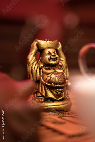 figurine of the golden buddha at the tea ceremony. tradition