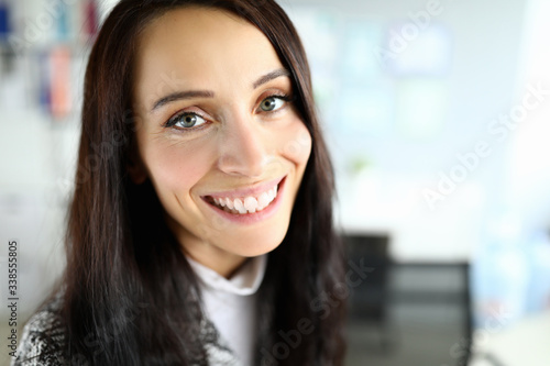 Wallpaper Mural Close-up of cheerful smiling female posing on camera. Macro shot of brunette young woman with beautiful appearance. Copy space in right side. Modeling and beauty concept Torontodigital.ca