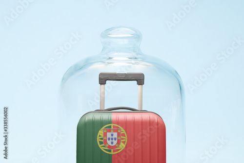 Luggage in isolation under glass cover covid-19 Portuguese tourism abstract.
