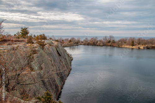 Calm water over a rocky quarry