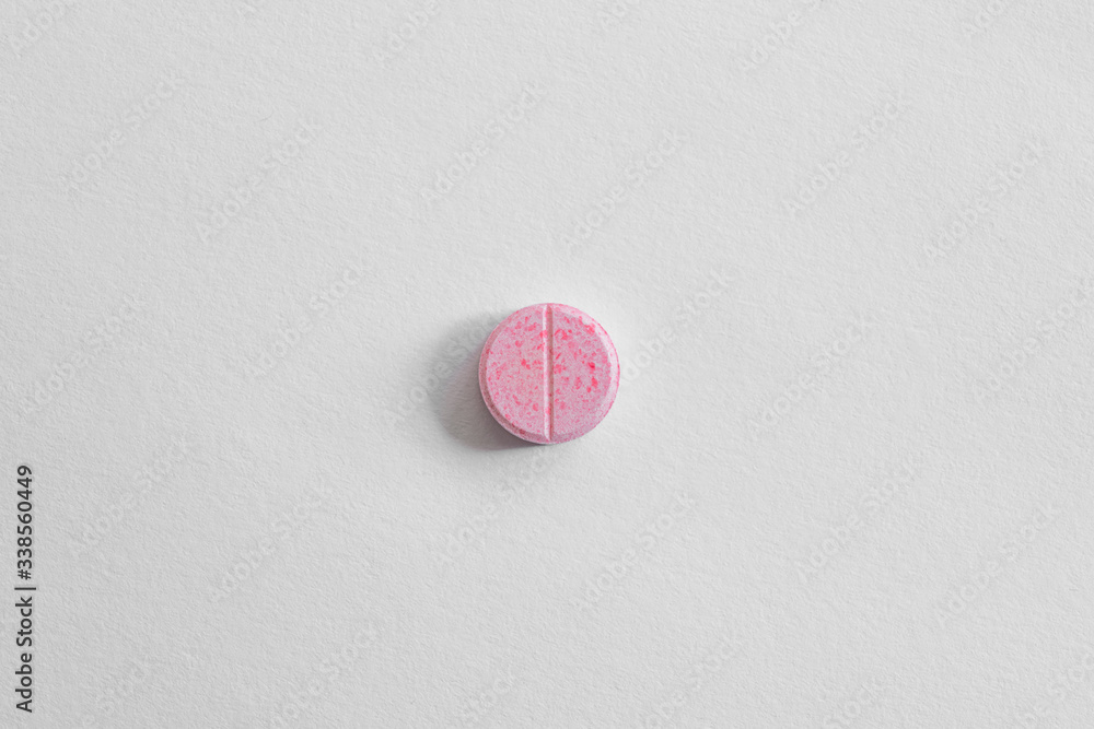 pink pill on white background. drugs isolated white copy space. healthcare medicine concept, aspirin, antibiotics pink pill on white background. drugs isolated white copy space. healthcare medicine concept, aspirin, antibiotics