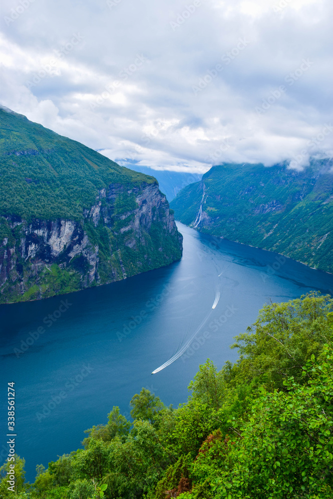 Landscape of Geirangerfjord and Seven Sisters Waterfall near small village of Geiranger. View from Eagles Road viewpoint.  Norway.