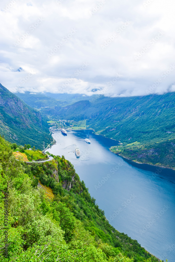 The cruise liners at the end of Geirangerfjord, near small village of Geiranger. View from Eagles Road.  Norway.