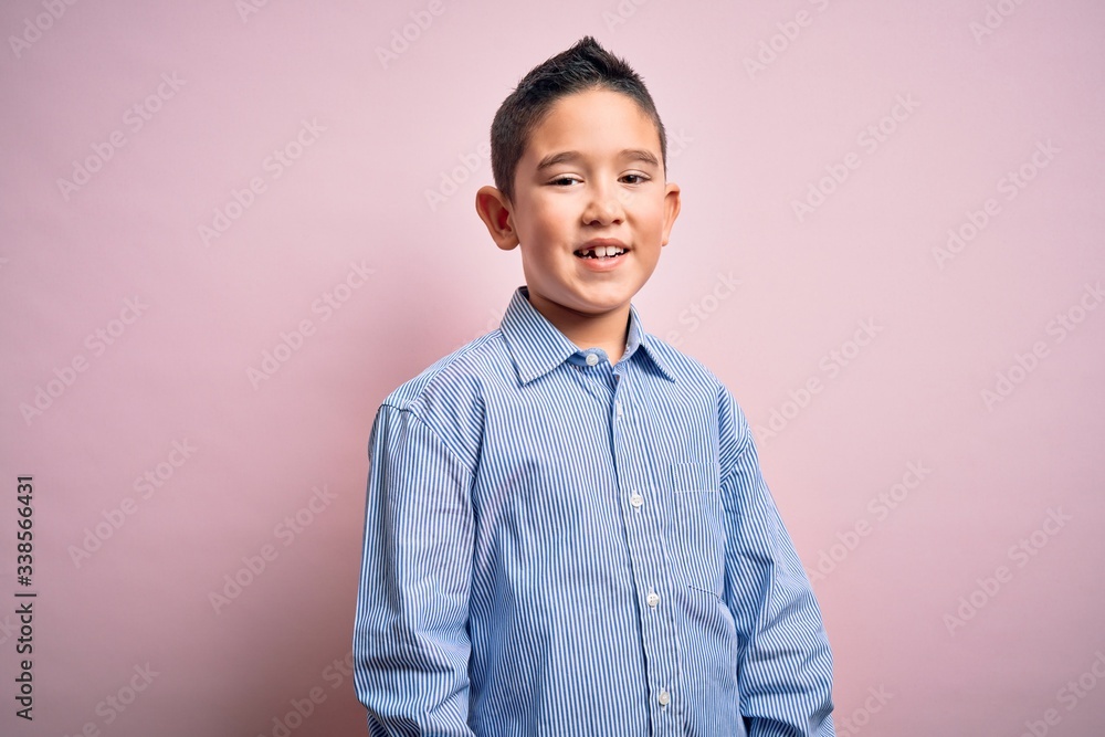 Young little boy kid wearing elegant shirt standing over pink isolated background with a happy and cool smile on face. Lucky person. Young little boy kid wearing elegant shirt standing over pink isolated background with a happy and cool smile on face. Lucky person.