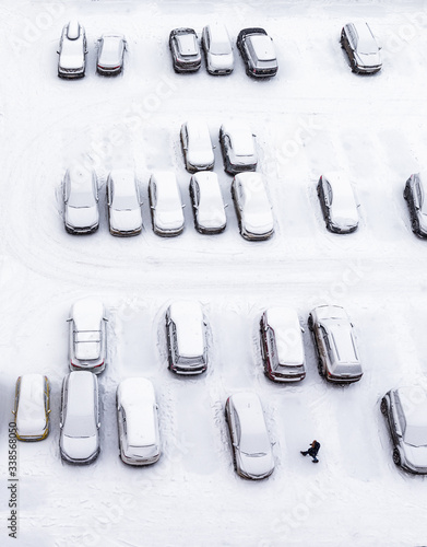 cars in the parking lot. view from above. cars in the snow.