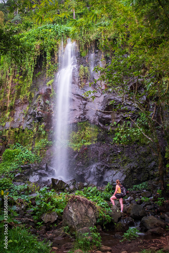A person admirnig the beauty waterfall réunion island, indian ocean