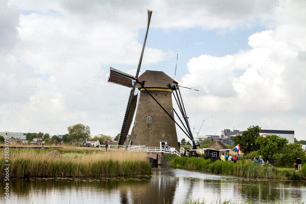 Netherlands rural lanscape with windmills at famous tourist site Kinderdijk, Rotterdam, in Holland. Old Dutch village Kinderdijk, UNESCO world heritage site.