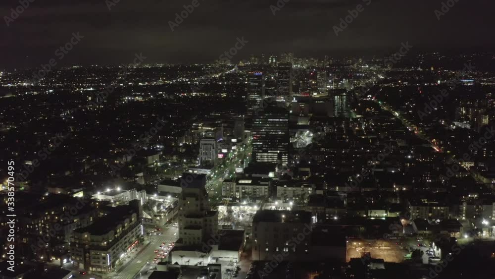 AERIAL: Over Dark Hollywood Los Angeles at Night with view on Skyline and City Lights AERIAL: Over Dark Hollywood Los Angeles at Night with view on Skyline and City Lights