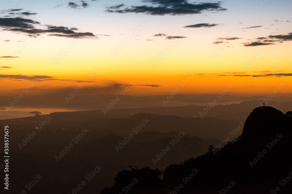 person watching the sunset in a mountain in Costa Rica