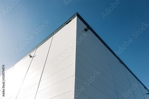  Basic Minimal Shape Abstract Exterior Warehouse or Construction Element Concept, Blue Sky and Cloud in Background with Copy Space