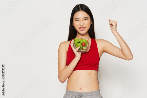 young woman holding a red apple © SHOTPRIME STUDIO