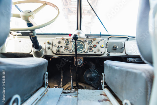 Dashboard and steering wheel of an old retro American van still in use. photo