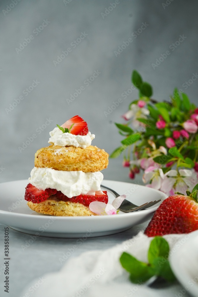 Homemade Strawberry shortcake with stuffed cream topping, selective focus Homemade Strawberry shortcake with stuffed cream topping, selective focus