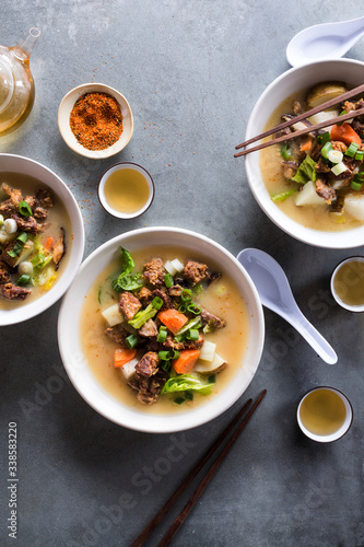 Overhead view of Cambodian beef stew served in bowl on table