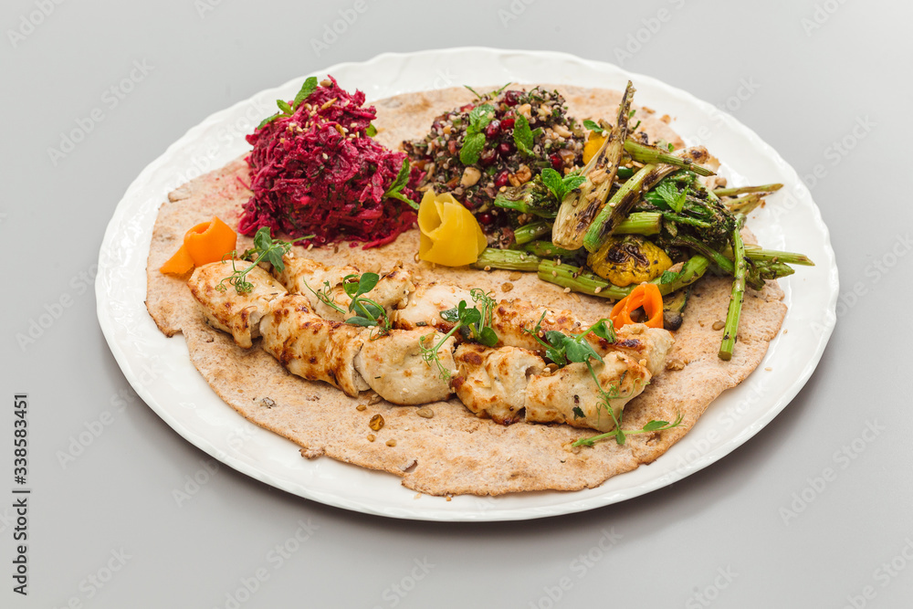 Grilled chicken tikka yoghurt with salad side dish. beetroot, asparagus, and quinoa. Perfect for healthy living vegetarian. Organic food photography concept. Grilled chicken tikka yoghurt with salad side dish. beetroot, asparagus, and quinoa. Perfect for healthy living vegetarian. Organic food photography concept.