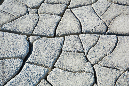 Dry soil with deep cracks. Cracked mud surface. Texture of cracks on the ground. photo