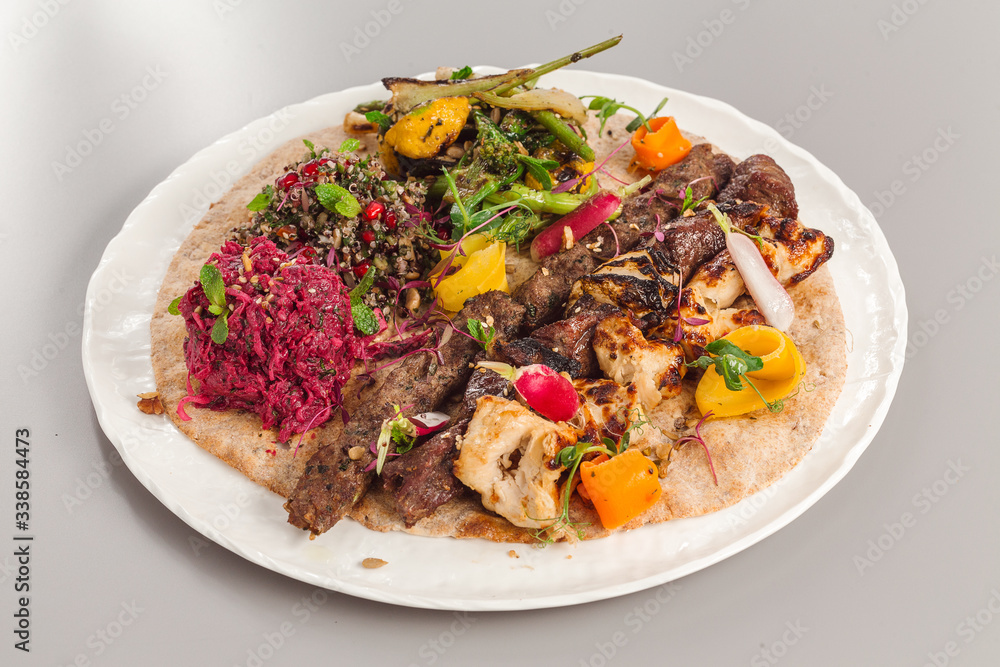 Delicious homemade kebab and chicken tikka salad side dish. beetroot, asparagus, and quinoa. Organic food photography. Delicious homemade kebab and chicken tikka salad side dish. beetroot, asparagus, and quinoa. Organic food photography.