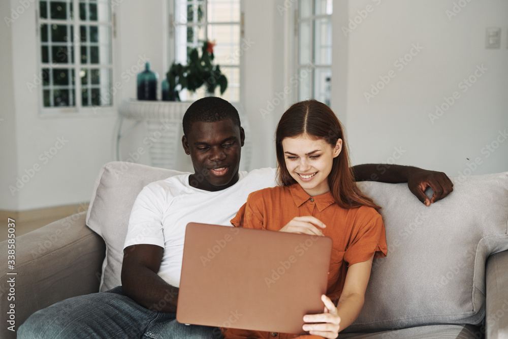 happy couple using laptop happy couple using laptop