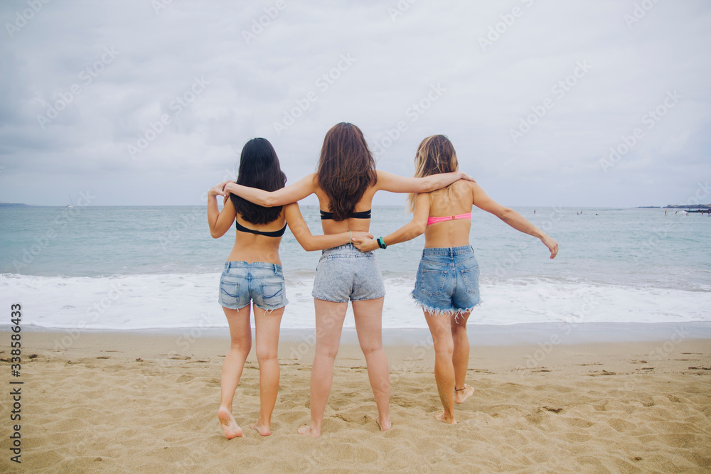 happy girlfriends on the sea sand happy girlfriends on the sea sand