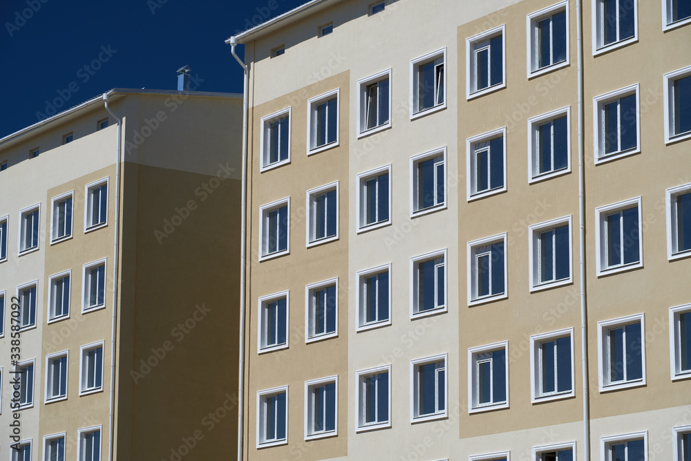 facade of a new multi-storey building with many windows