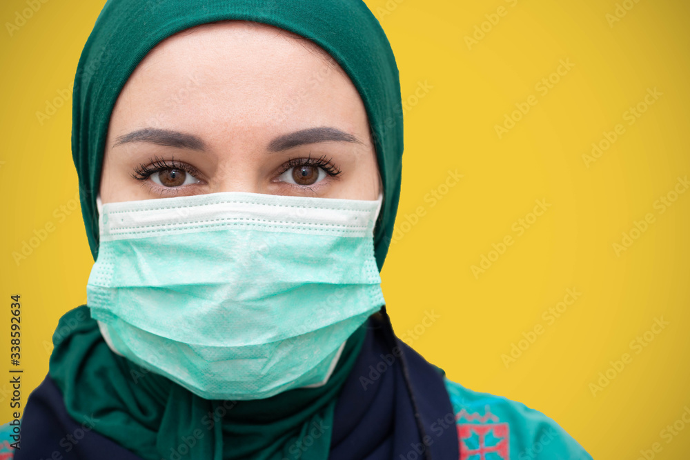 Muslim girl wearing surgical mask for protection. Hijab woman take a mask. muslim girl wearing mask for