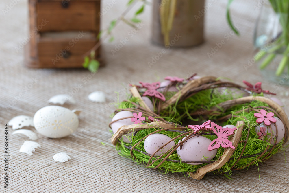 Beautiful Easter decoration - hen, faucet with Easter eggs and nice flowers. Photo on a light background. Beautiful Easter decoration - hen, faucet with Easter eggs and nice flowers. Photo on a light background.