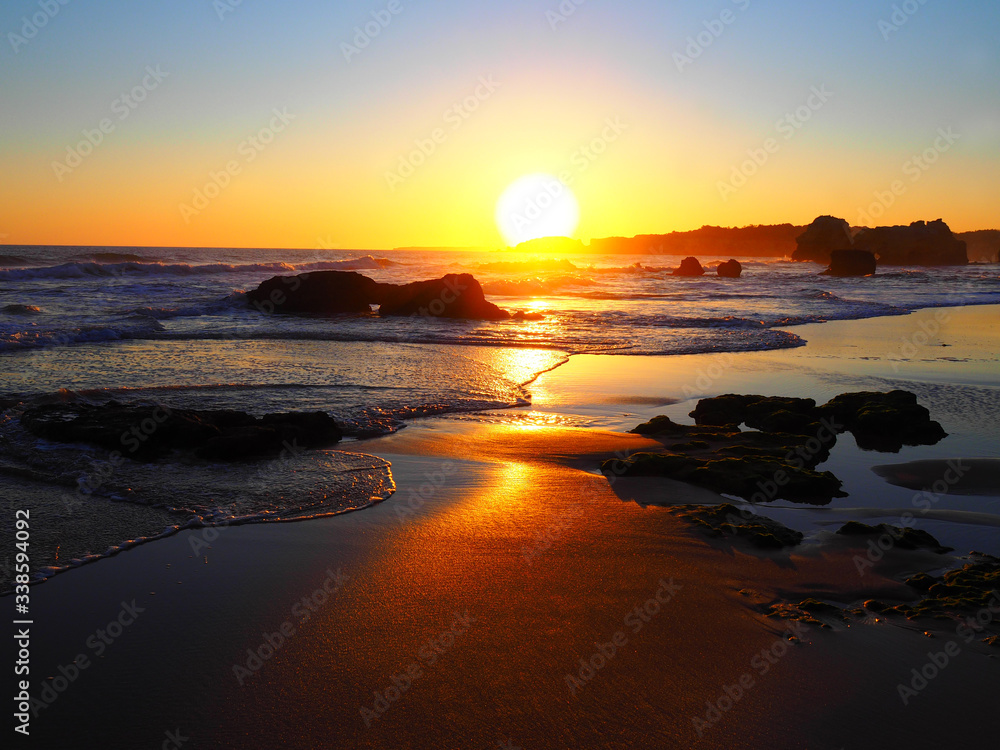 Naklejka premium View of Praia dos Tres Castelos beach at sunset in Portimao, Algarve, Portugal