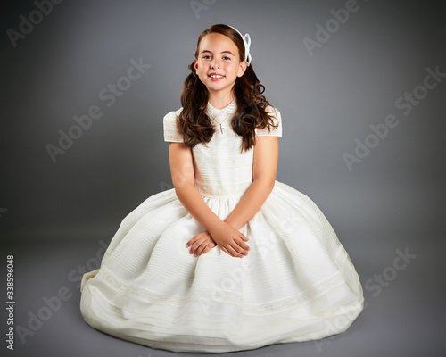 Gorgeous young girl dressed in white