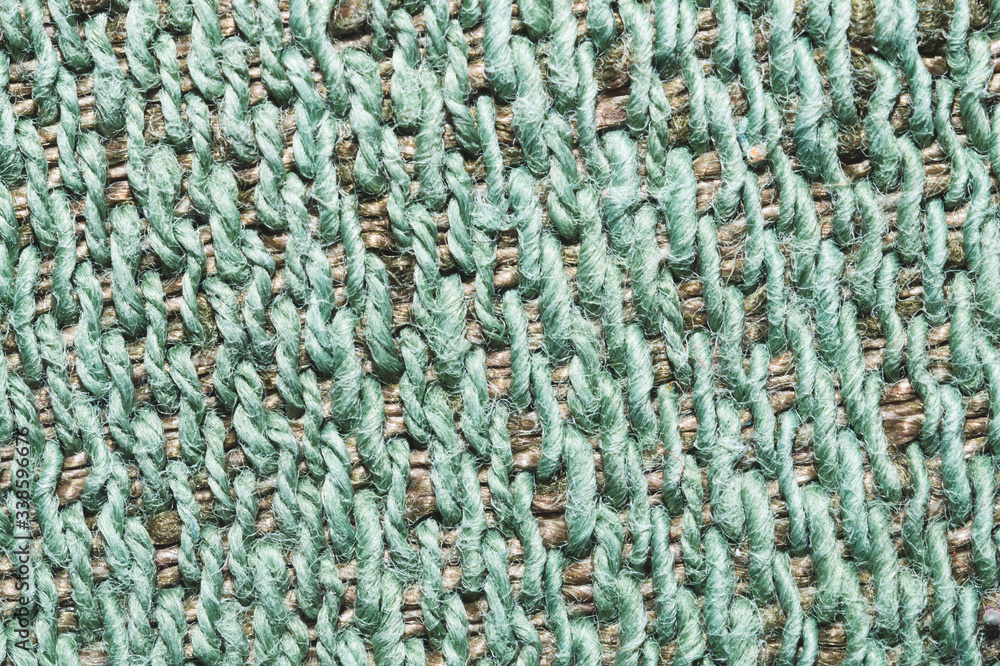 Fabric macro texture. knitted material. woven background. woolen textile close up Fabric macro texture. knitted material. woven background. woolen textile close up