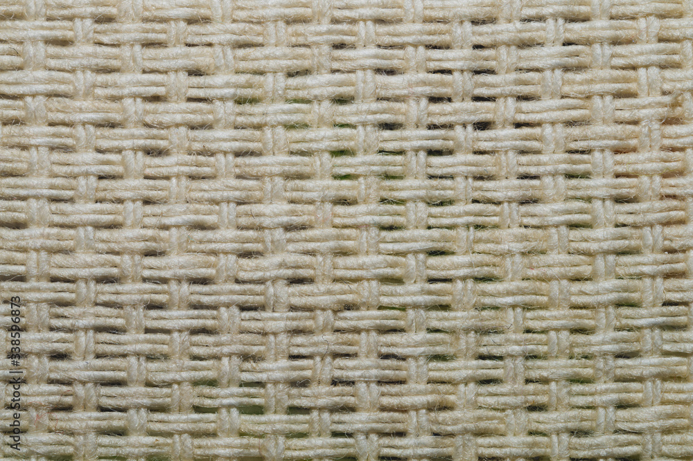Fabric macro texture. knitted material. woven background. woolen textile close up Fabric macro texture. knitted material. woven background. woolen textile close up