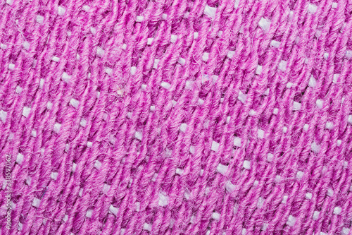Pink fabric texture. knitted textile background. woven material macro