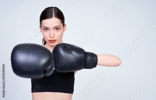 Sports fitness caucasian girl in boxing training.