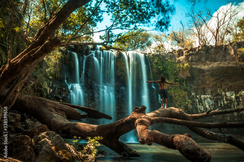 Fototapeta Naklejka Na Ścianę i Meble -  Person in a waterfall in the jungle