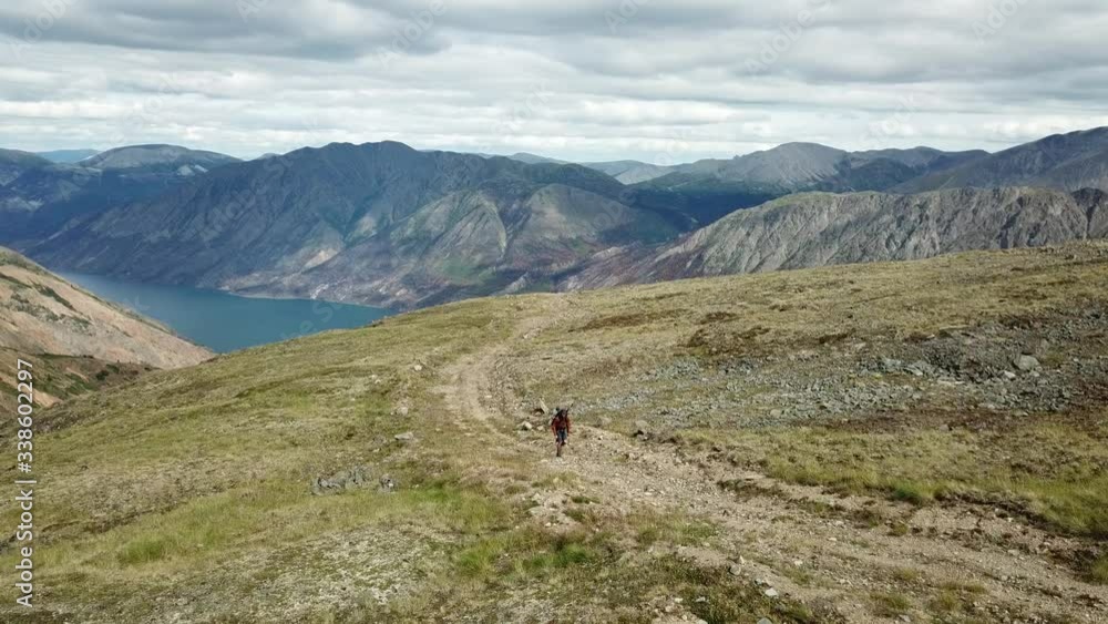Hiker at Dail Peak near Carcross Yukon Hiker at Dail Peak near Carcross Yukon