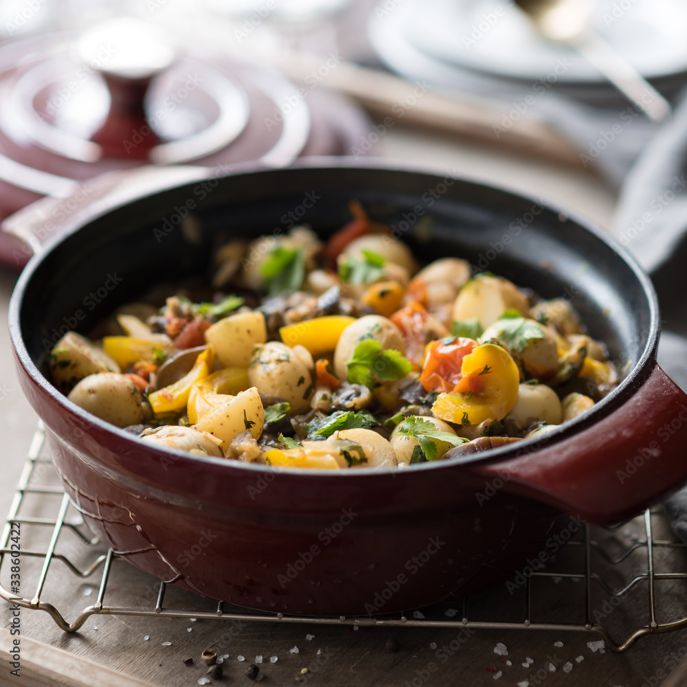 Homemade Vegetable Stew with Potatoes, Pepper, Tomatoes and Eggplant in Cast Iron Casserole Homemade Vegetable Stew with Potatoes, Pepper, Tomatoes and Eggplant in Cast Iron Casserole