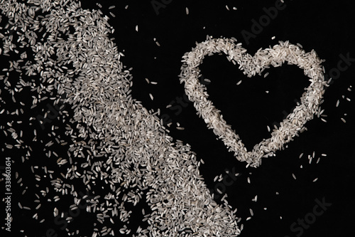 heart made of rice on dark backgrounds